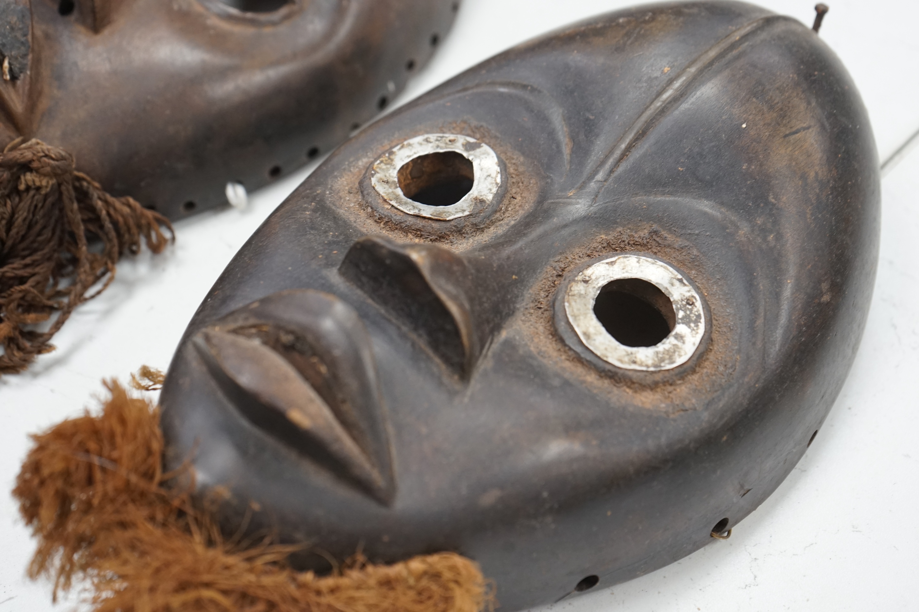 Two African Ivory Coast/Liberian Dan masks, 23cm high. Condition - fair